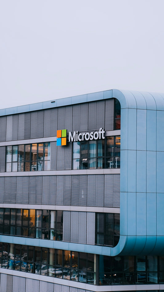A tall building with a microsoft logo on it